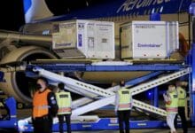 A shipment of 900,000 doses of Sinovac coronavirus disease (COVID-19) vaccine is unloaded from an aircraft after arriving from China at Ezeiza International Airport, in Buenos Aires, Argentina, February 25, 2021. REUTERS/Agustin Marcarian