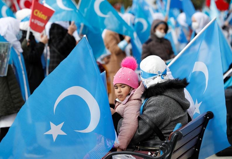 Ethnic Uighur demonstrators wave East Turkestan flags during a gathering on the occasion of International Women's Day to protest China's treatment of Uighurs, in Istanbul, Turkey March 8, 2021. REUTERS/Murad Sezer