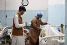 A victim receives medical assistance in a hospital after he was wounded in the deadly attacks outside the airport in Kabul, Afghanistan, Thursday, Aug. 26, 2021. Two suicide bombers and gunmen attacked crowds of Afghans flocking to Kabul's airport Thursday, transforming a scene of desperation into one of horror in the waning days of an airlift for those fleeing the Taliban takeover. (AP Photo/Khwaja Tawfiq Sediqi)