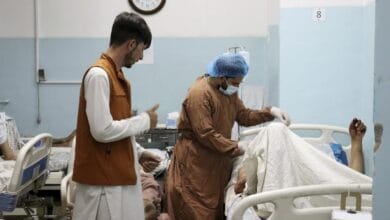 A victim receives medical assistance in a hospital after he was wounded in the deadly attacks outside the airport in Kabul, Afghanistan, Thursday, Aug. 26, 2021. Two suicide bombers and gunmen attacked crowds of Afghans flocking to Kabul's airport Thursday, transforming a scene of desperation into one of horror in the waning days of an airlift for those fleeing the Taliban takeover. (AP Photo/Khwaja Tawfiq Sediqi)