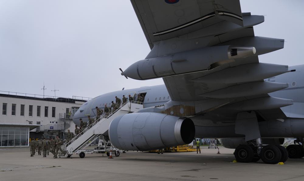 Members of the British armed forces 16 Air Assault Brigade walk to the air terminal after disembarking a RAF Voyager aircraft at Brize Norton, England, as they return from helping in operations to evacuate people from Kabul airport in Afghanistan, Saturday, Aug. 28, 2021. More than 100,000 people have been safely evacuated through the Kabul airport, according to the U.S., but thousands more are struggling to leave in one of history's biggest airlifts. (AP Photo/Alastair Grant, Pool)