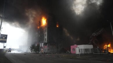 A building burns after shelling in Kyiv, Ukraine, Thursday, March 3, 2022. Russia has launched a wide-ranging attack on Ukraine, hitting cities and bases with airstrikes or shelling. (AP Photo/Efrem Lukatsky)