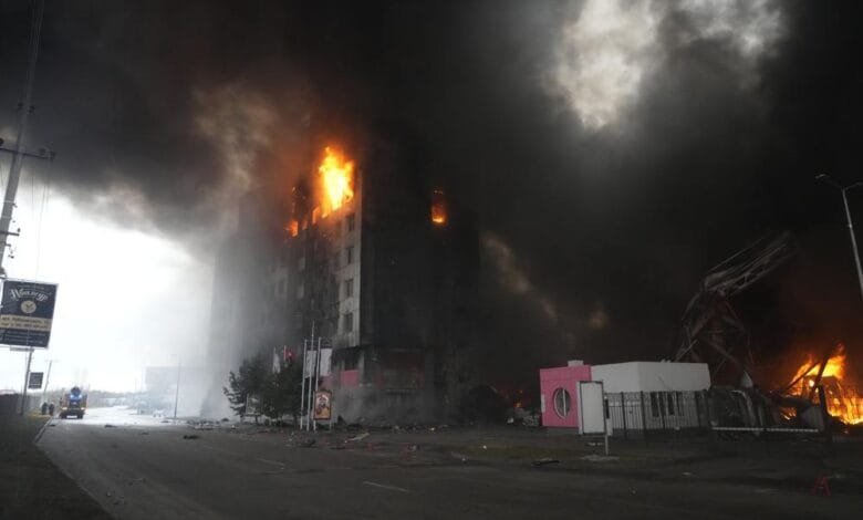 A building burns after shelling in Kyiv, Ukraine, Thursday, March 3, 2022. Russia has launched a wide-ranging attack on Ukraine, hitting cities and bases with airstrikes or shelling. (AP Photo/Efrem Lukatsky)