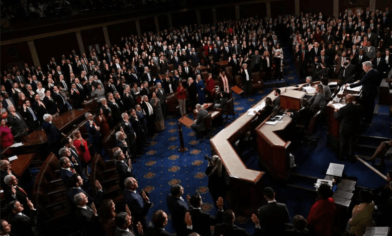 Members of the 118th Congress raise their right hands as they are sworn into office to serve in the U.S. House of Representatives on the fourth day of Congress at the U.S. Capitol in Washington, U.S., January 7, 2023. REUTERS/Jon Cherry