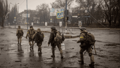 Ukrainian troops move through the streets of Bakhmut, eastern Ukraine, as fighting against Russian forces there rages and casualties mount. Photograph: Chris McGrath/Getty Images